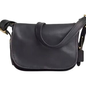 **Vintage Coach Patricia’s Legacy black leather flap shoulder bag.**